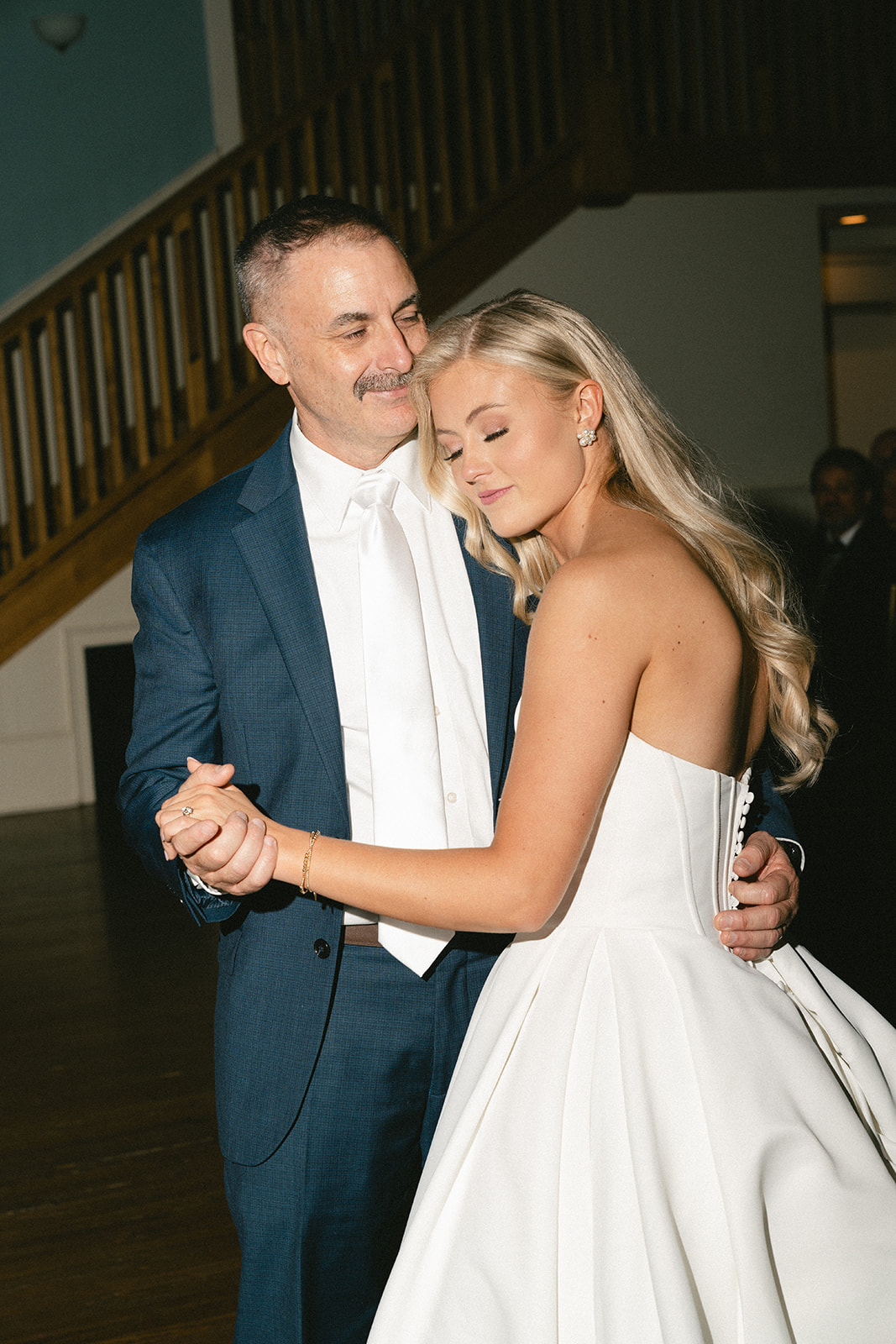 bride has a first dance with her father on her wedding day