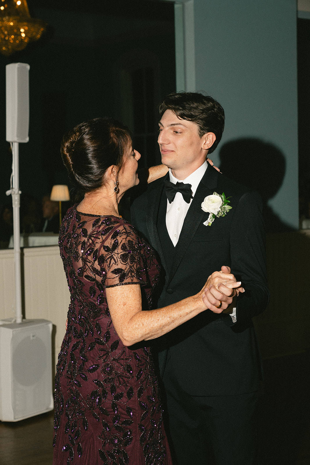 Groom has a first dance with his mother on his wedding day