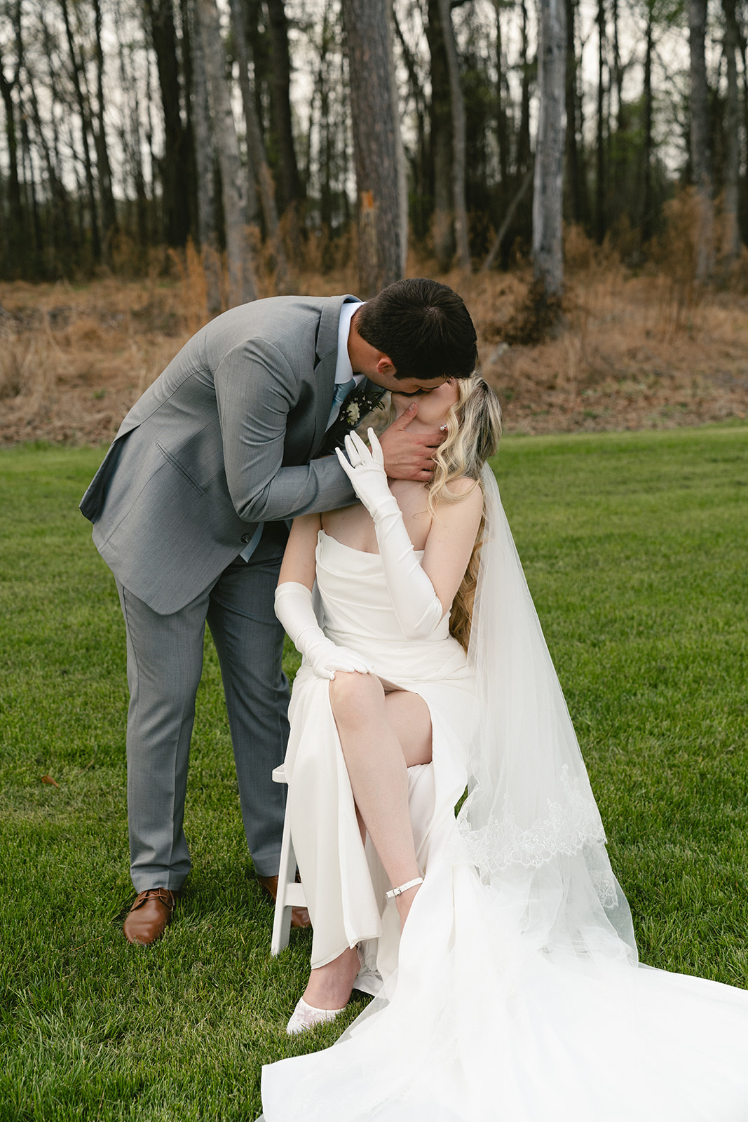 A bride and groom take wedding portraits outdoors taken by a North Carolina wedding photographer
