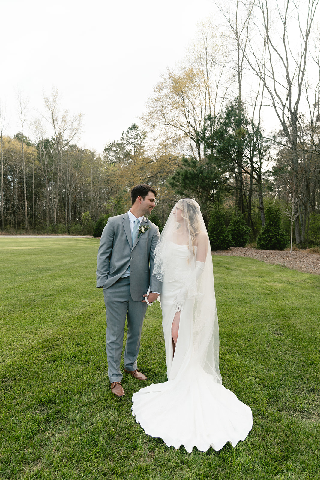  A bride and groom take wedding portraits outdoors taken by a North Carolina wedding photographer