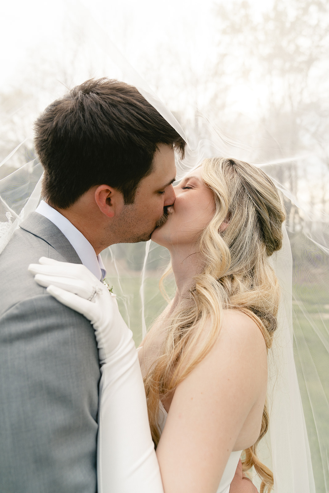  A bride and groom take wedding portraits outdoors taken by a North Carolina wedding photographer